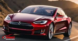 A red Tesla car running on a road