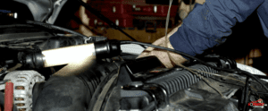 NCC-mechanic repairing car engine